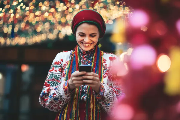 A woman in a luxurious green gown next to an ornate roulette wheel, capturing the upscale casino mood of JL1.