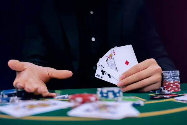 JL1 Mobile Casino — Play anytime, anywhere A player using their smartphone during a festive local event, representing JL1’s fully mobile-friendly casino.