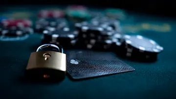 A laptop glowing with a bright login prompt in a minimalistic setup, symbolizing the protected access system at JL1.